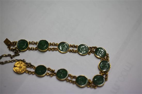A Chinese high carat double chain link gold and jadeite bracelet, 6.5in.